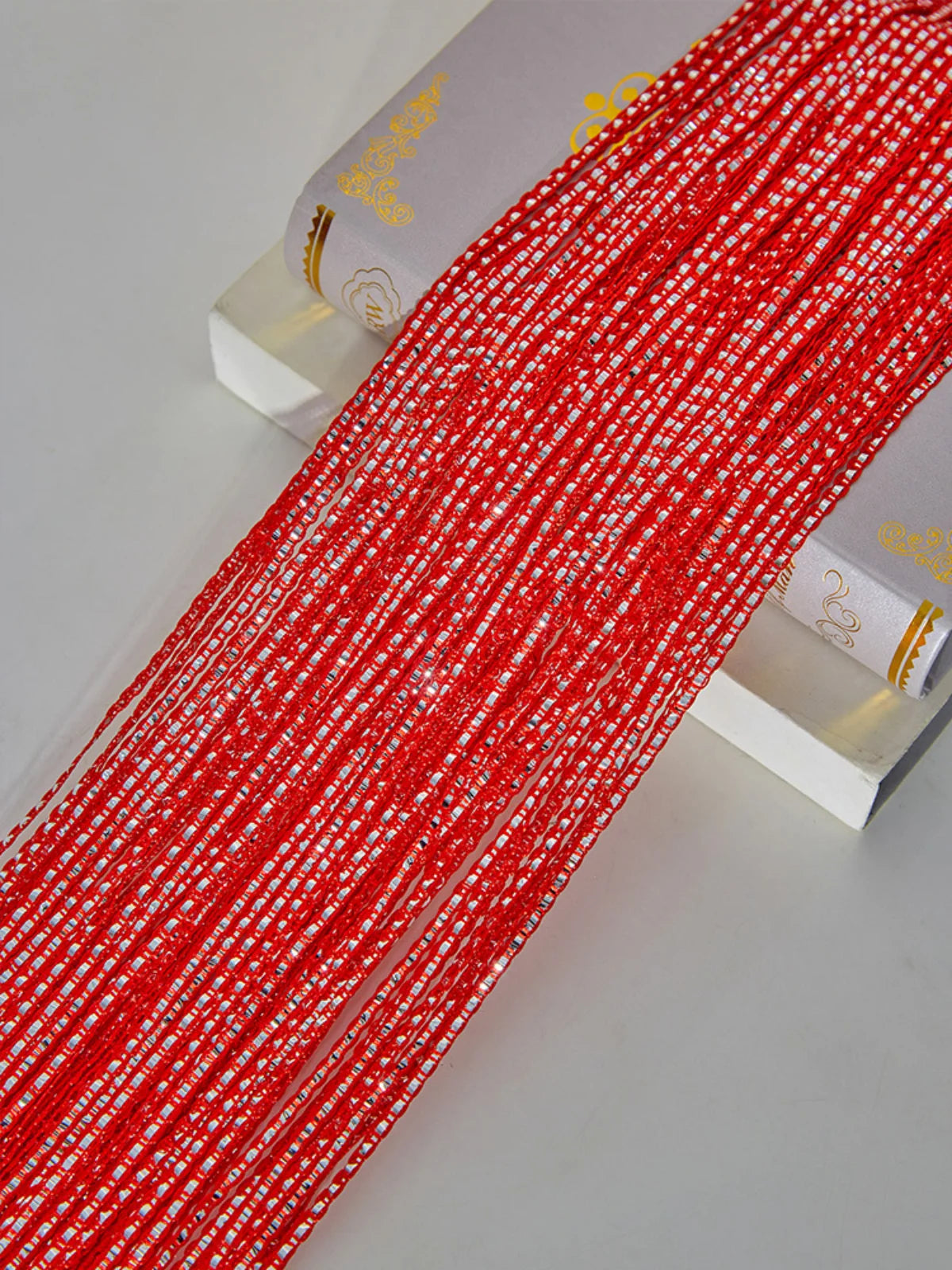 Red and white woven tassel string curtain for doorways and room dividers