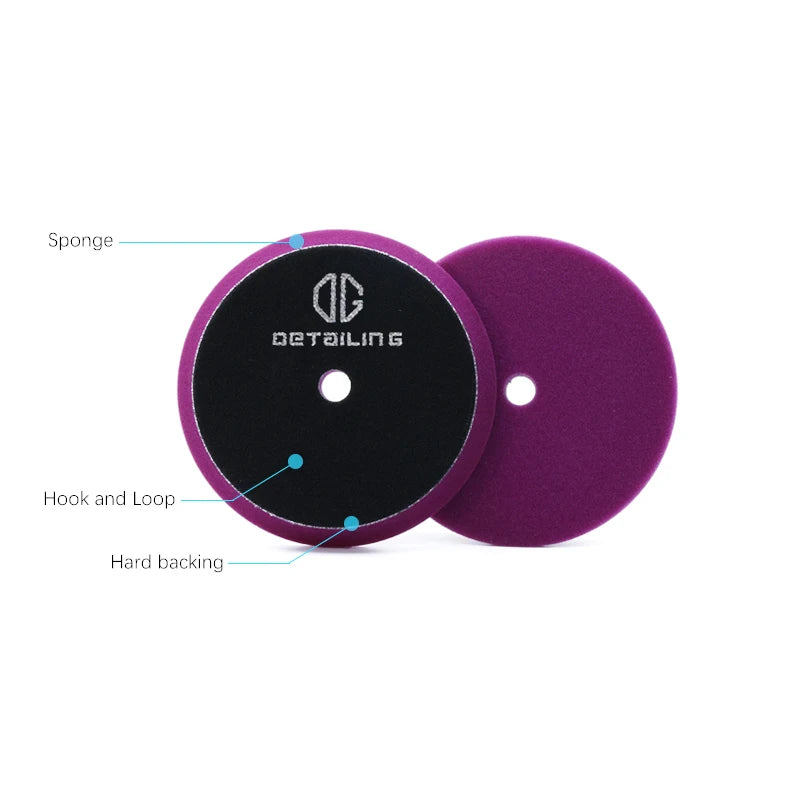 A purple foam polishing pad with a black surface and a visible hook and loop.