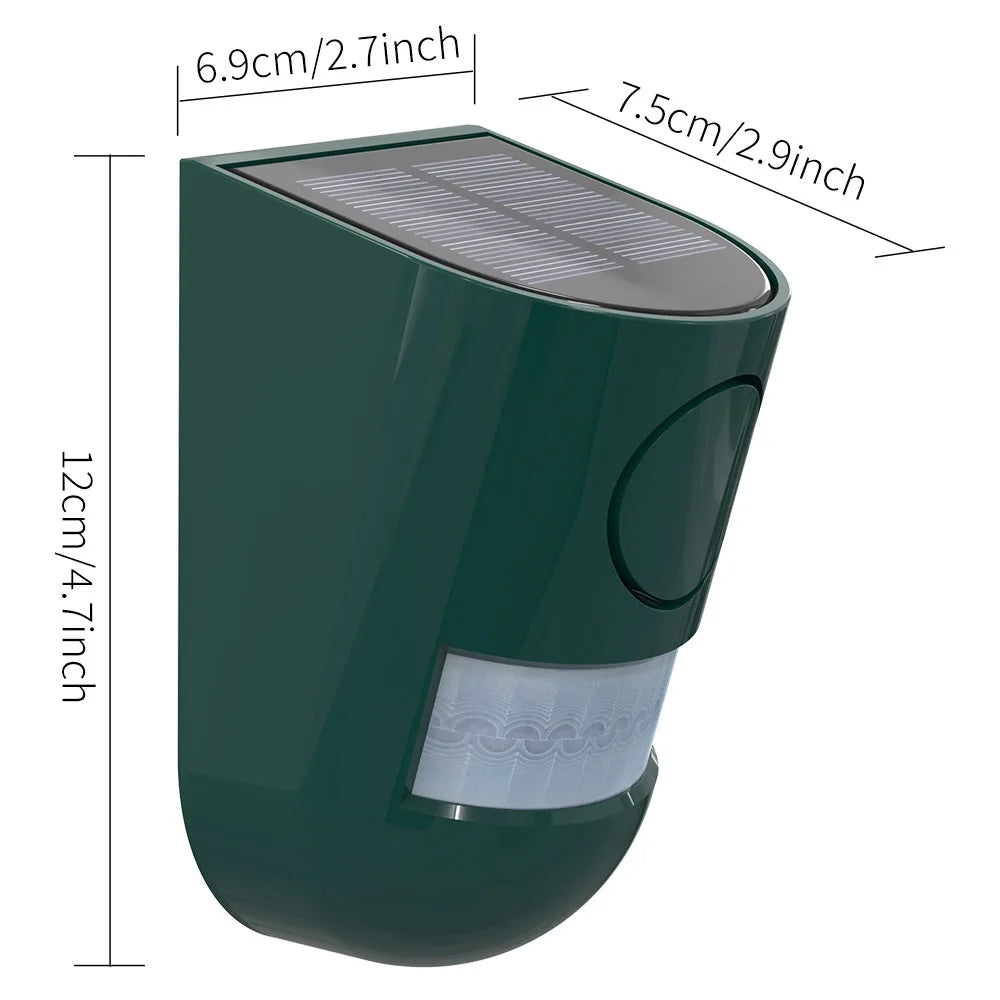 A dark green solar-powered motion sensor alarm with a light panel and strobe feature.
