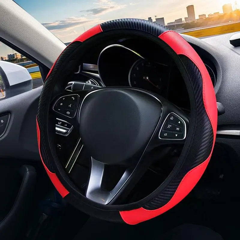 Close-up view of a red and black steering wheel cover with non-slip grip inside a car