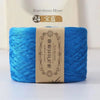 Blue bamboo fiber yarn skein labeled for knitting and crochet