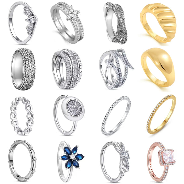 Sammlungen stapelbarer Moderinge mit floralen und flügelartigen Designs in Silber- und Goldtönen.