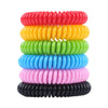 A stack of ten colorful, natural DEET-free mosquito repellent bracelets in red, yellow, green, blue, pink, and black.