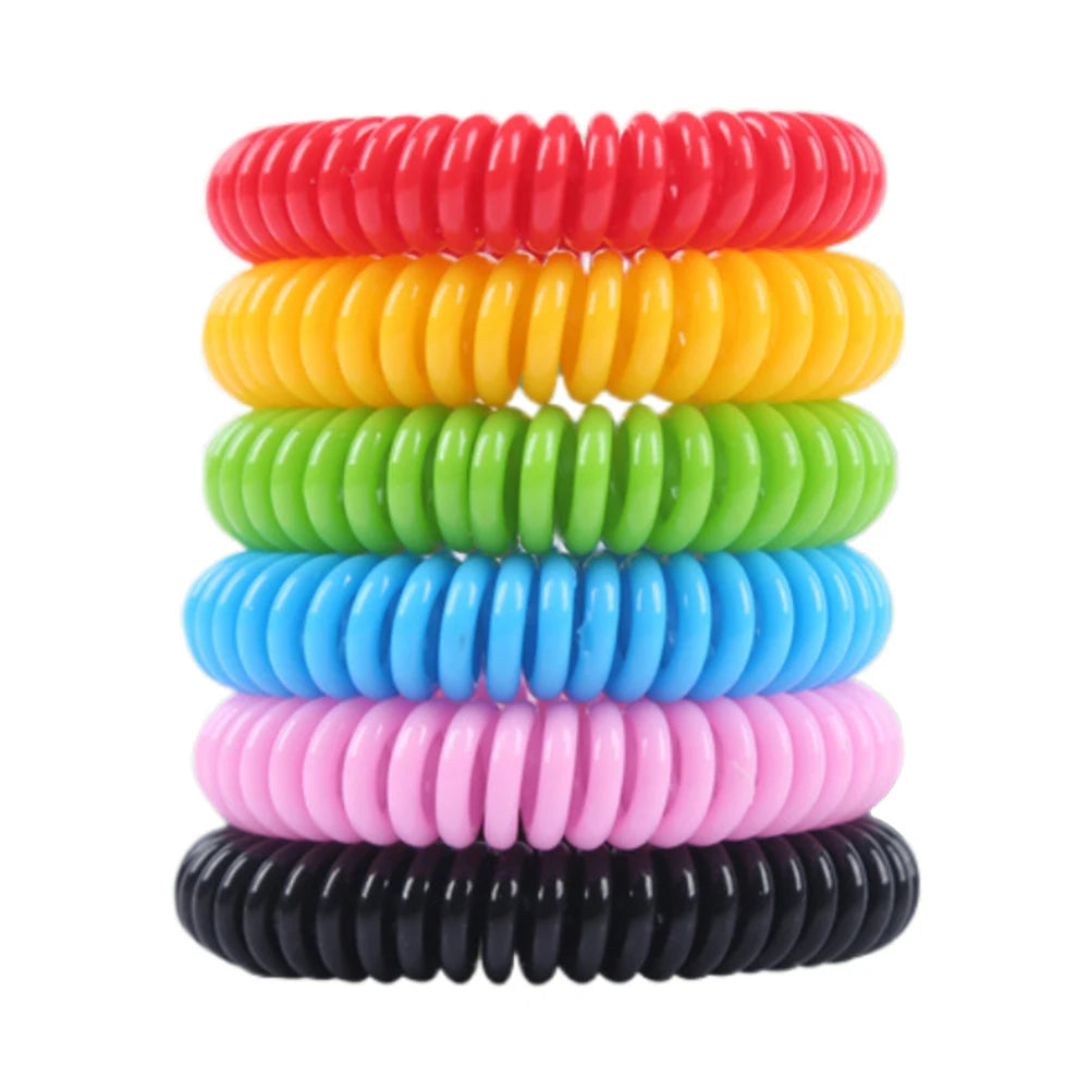 A stack of ten colorful, natural DEET-free mosquito repellent bracelets in red, yellow, green, blue, pink, and black.