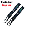 A black lanyard with a stay positive message on the front and back, featuring an eagle beak clasp.