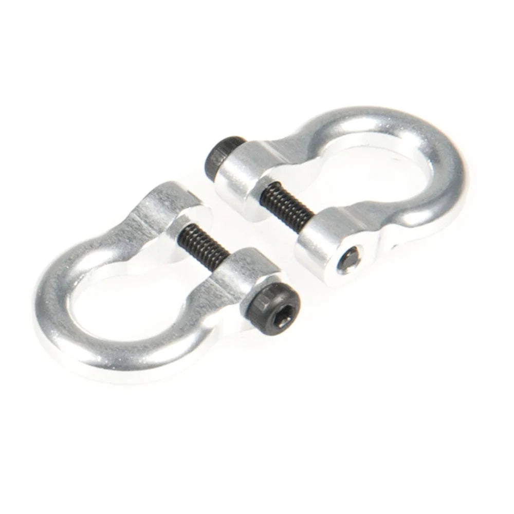 A pair of metal alloy tow shackles for an RC crawler, showing the shackles and connecting pins.