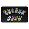 A collection of ten die-cast pull-back cars in various colors and designs displayed on a black surface.