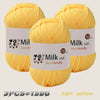 Three skeins of light yellow milk cotton yarn are displayed, showing the texture and packaging.