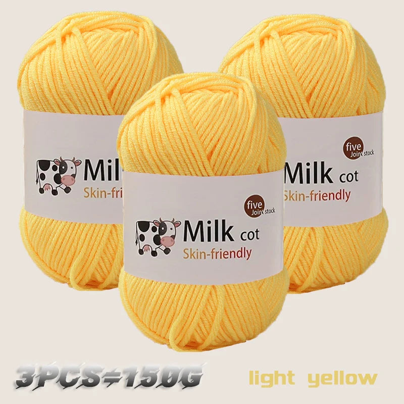 Three skeins of light yellow milk cotton yarn are displayed, showing the texture and packaging.