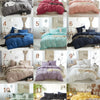 A collection of ten beds featuring soft washed duvet covers in various shades of pink, purple, blue, and green with pom-pom t