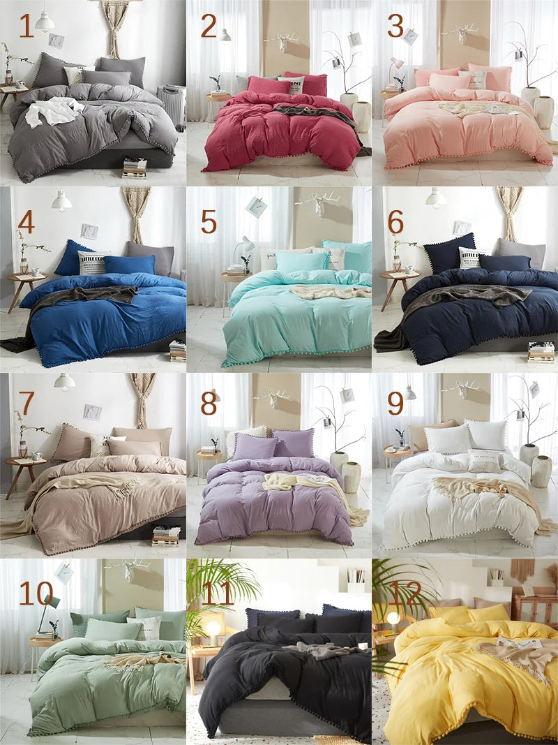 A collection of ten beds featuring soft washed duvet covers in various shades of pink, purple, blue, and green with pom-pom t