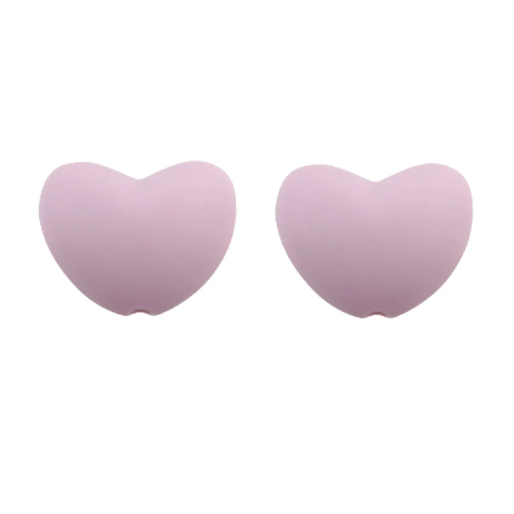 A pair of light purple silicone heart beads for DIY jewelry making