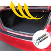 A red car trunk interior showing a universal adjustable lift spring kit for the trunk.