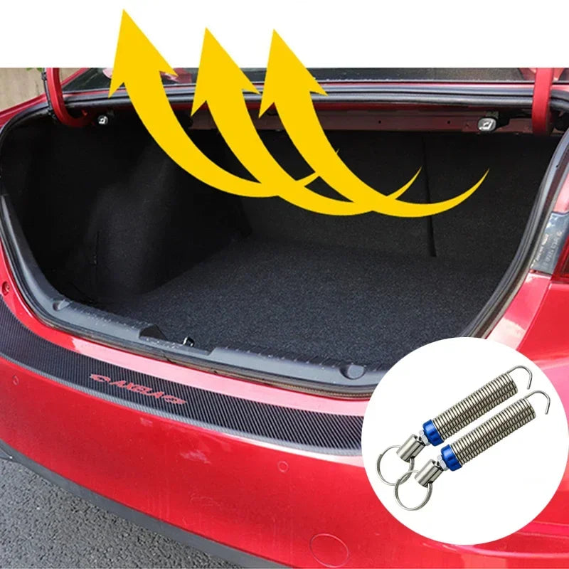 A red car trunk interior showing a universal adjustable lift spring kit for the trunk.