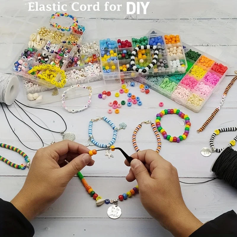 Hands are assembling jewelry from various colored elastic cords and beads for DIY projects.
