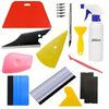 A collection of professional car window tinting tools including blades, squeegees, and various plastic tools in red, black, y