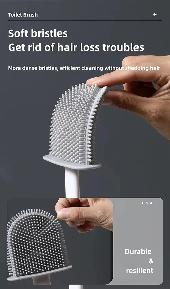 A hand holds a white toilet brush with a silicone bristles head, demonstrating its dense bristles and durable design.