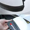 A close-up of a black and white universal carbon fiber rain cover for a car side mirror.