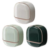 A pair of waterproof hanging soap holders in light beige and dark green colors.