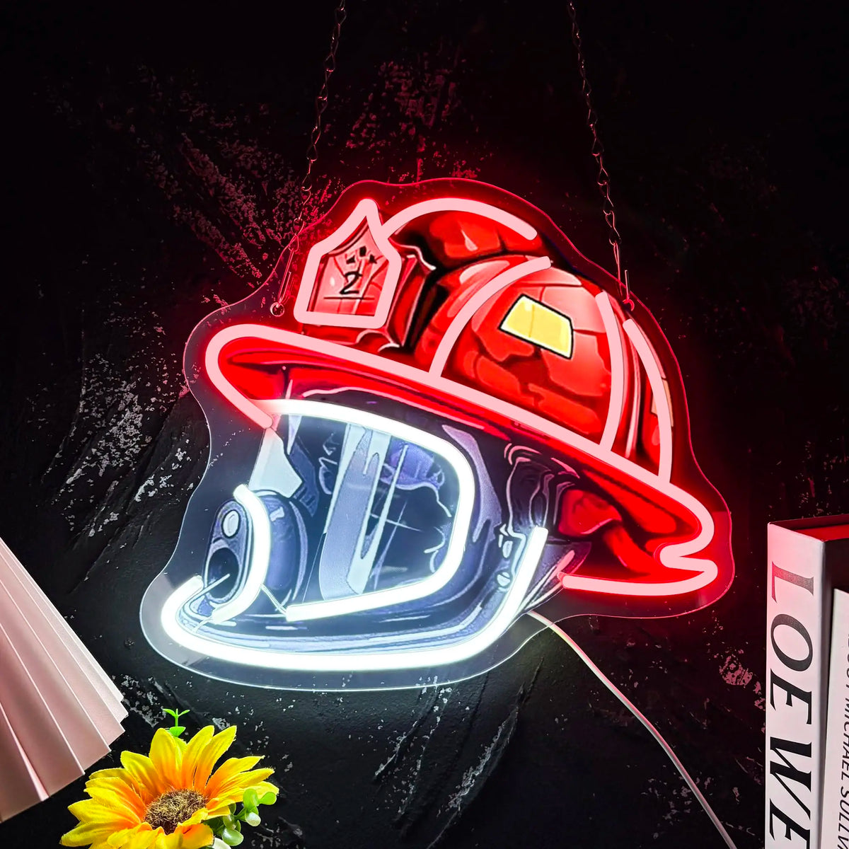 A red firefighter helmet neon sign with a glowing blue visor and faceplate against a dark background.