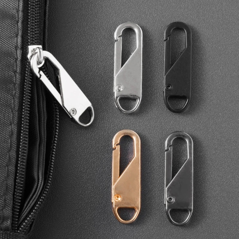 A collection of metal zipper pulls in silver, black, and rose gold are displayed against a dark gray background.