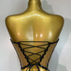 A gold-toned mannequin displays a black, laced two-piece party outfit with a see-through top.