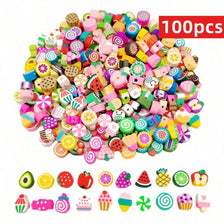 A large pile of 100 assorted polymer clay beads shaped like summer fruits for jewelry making
