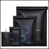 A set of black RFID blocking Faraday bags with various sizes for protecting car keys and phones.