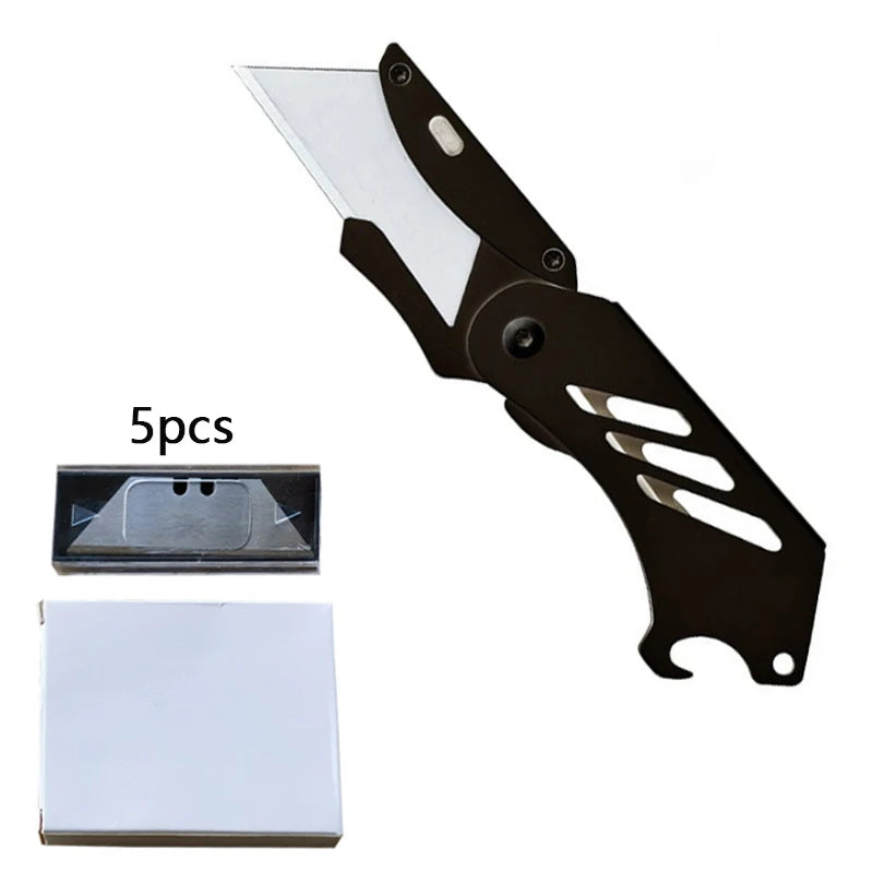 A black folding utility knife with a stainless steel blade and five replacement blades shown alongside the knife.