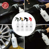 A collection of black and yellow cleaning spray bottles being used on a car surface.