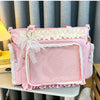 A pink Y2K Lolita transparent shoulder bag with white lace trim displayed on a shelf.