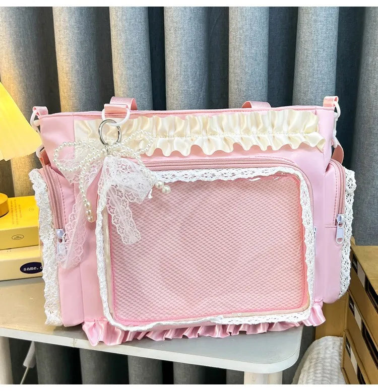 A pink Y2K Lolita transparent shoulder bag with white lace trim displayed on a shelf.