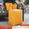 A large yellow waterproof moving and storage bag is shown being loaded into the trunk of a car.