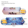 Pink box of French fries decoration kit with music-themed girls figures and yellow fries