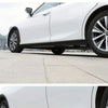 A white car features a black self-adhesive PVC side skirt and door edge protection strip on the lower body.