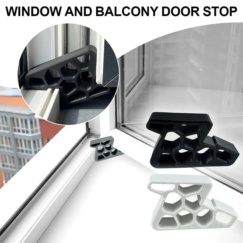 Close-up view of black and white window and balcony door stop wedges for sealing gaps.