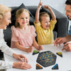 A family is playing the Jumping Pirates Board Game on a table, with game pieces visible.