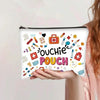 A pink canvas charger storage pouch with colorful medical and first aid icons.