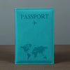 A teal leather passport holder featuring a world map and an airplane icon embossed on the cover.