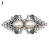 Vintage swirl sweater clip featuring a pearl and sparkling stones for cardigans and shawls