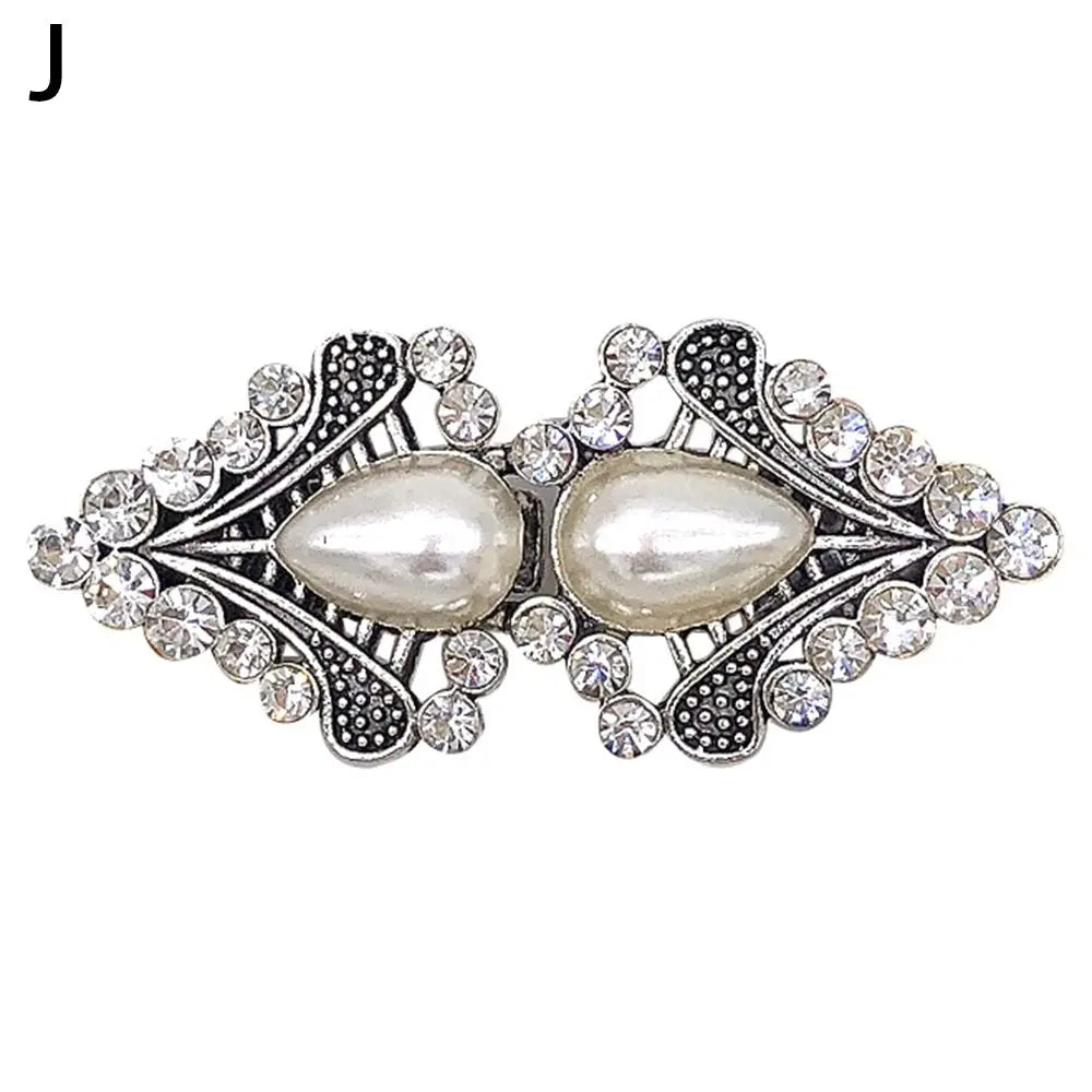 Vintage swirl sweater clip featuring a pearl and sparkling stones for cardigans and shawls
