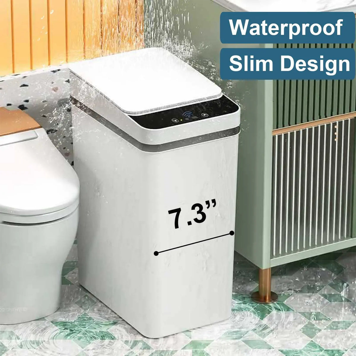 A white slim touchless trash can with a lid is shown next to a toilet and a cabinet.