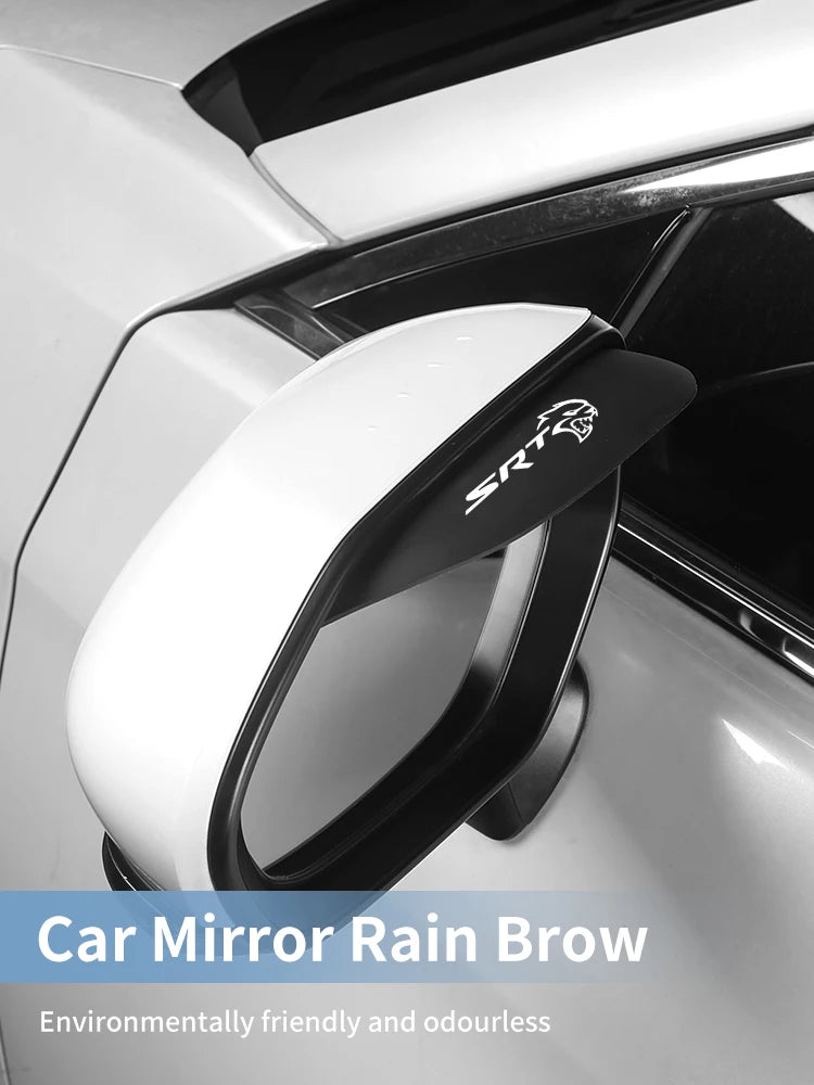 A close-up of an SRT car mirror rain brow accessory installed on a white car side mirror.