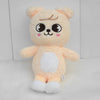 A soft, light orange and white plush toy resembling a cute animal character with large eyes.