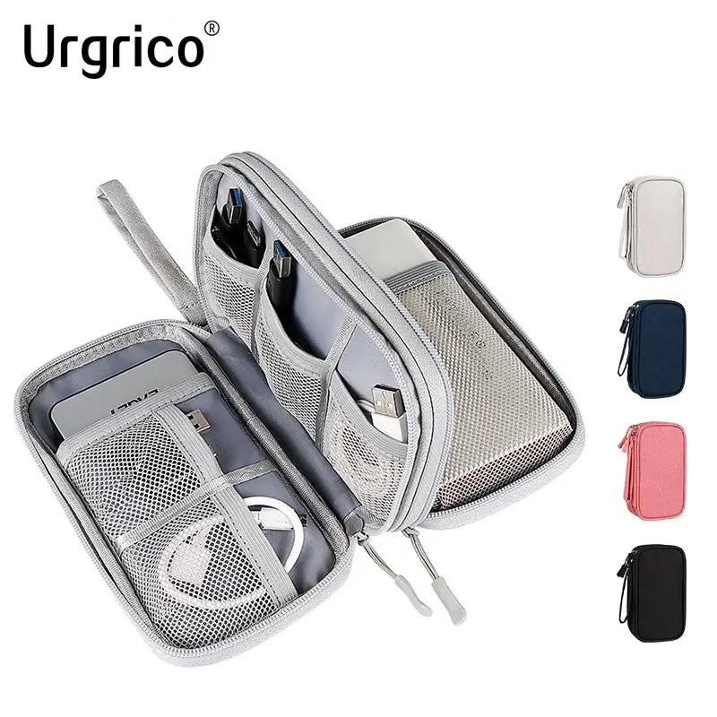 A silver nylon cable organizer travel case with multiple compartments and a matching pink pouch.