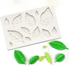 White silicone mold with various leaf shapes for candle making and crafting