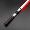 A close-up view of a Neo Pixel lightsaber with a red blade and a textured grip against a dark background.