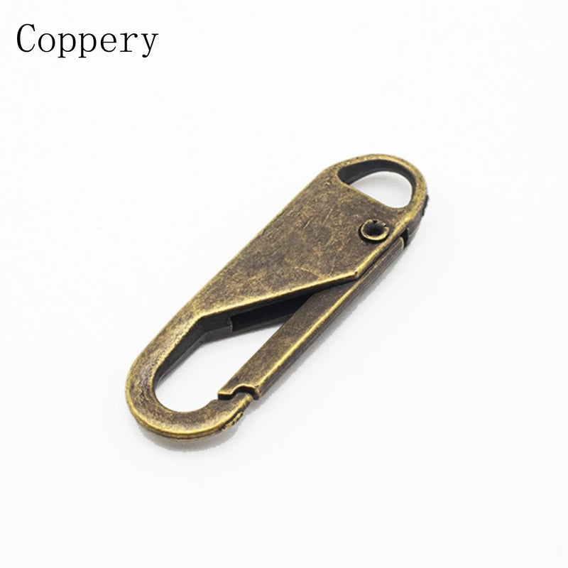 A brass copper zipper pull with a loop and a sliding mechanism.