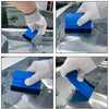 A hand wearing a white glove is applying a blue and black professional car window tint kit to a car window.