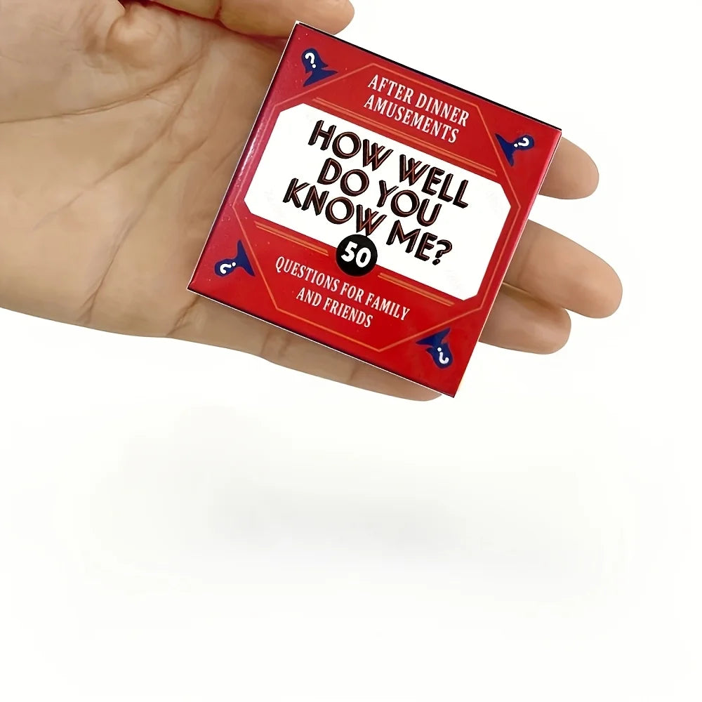 A hand holds a red card game titled How Well Do You Know Me? with questions for family and friends.